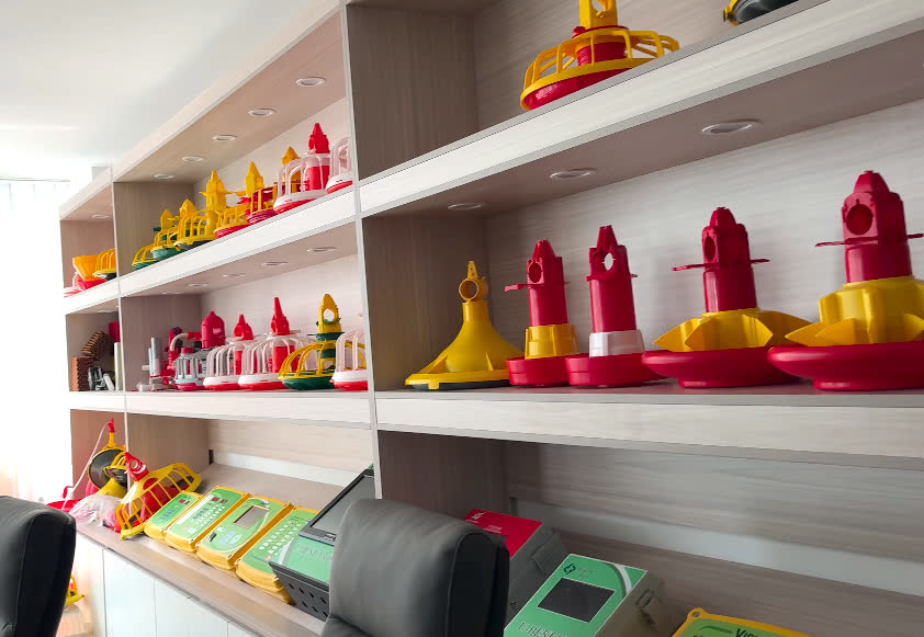 Shelves of feeder and controller models in a supplier's showroom