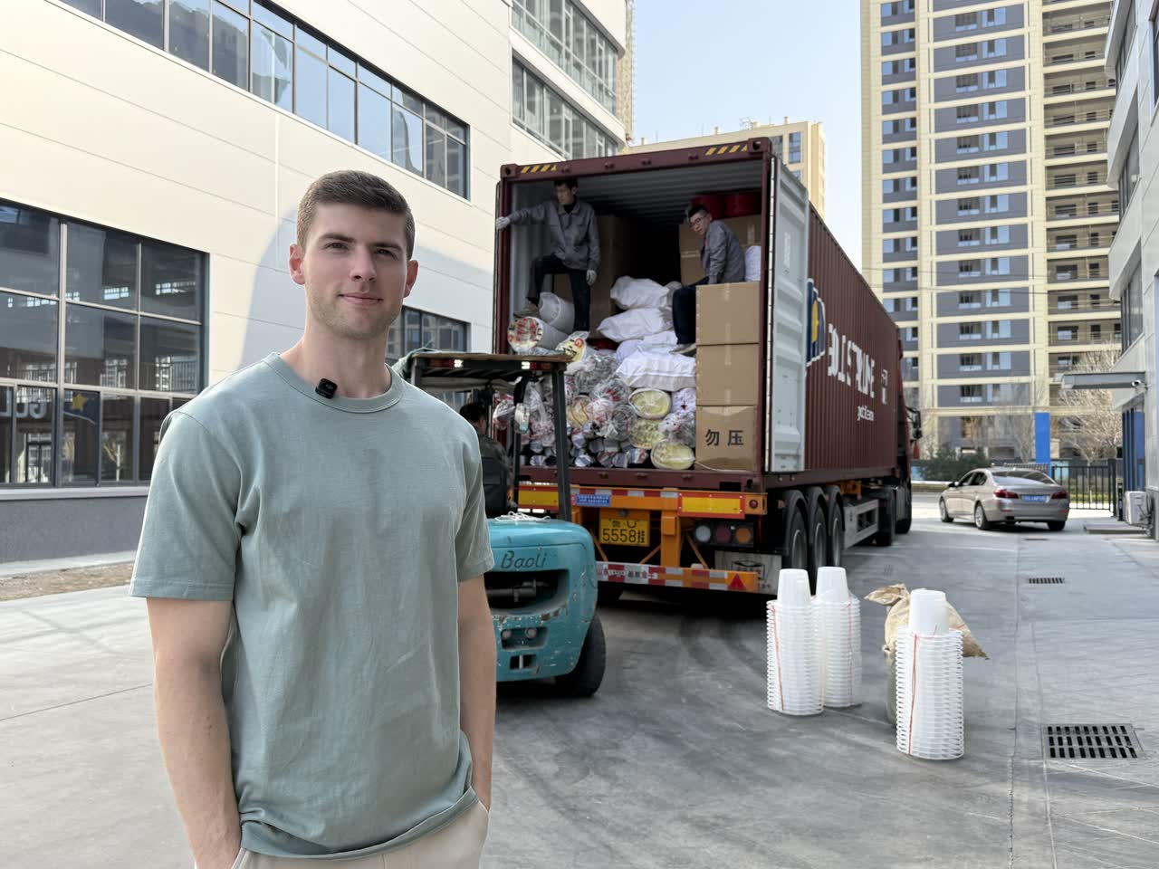 Andrew at a supplier's facility while a container of equipment is loaded